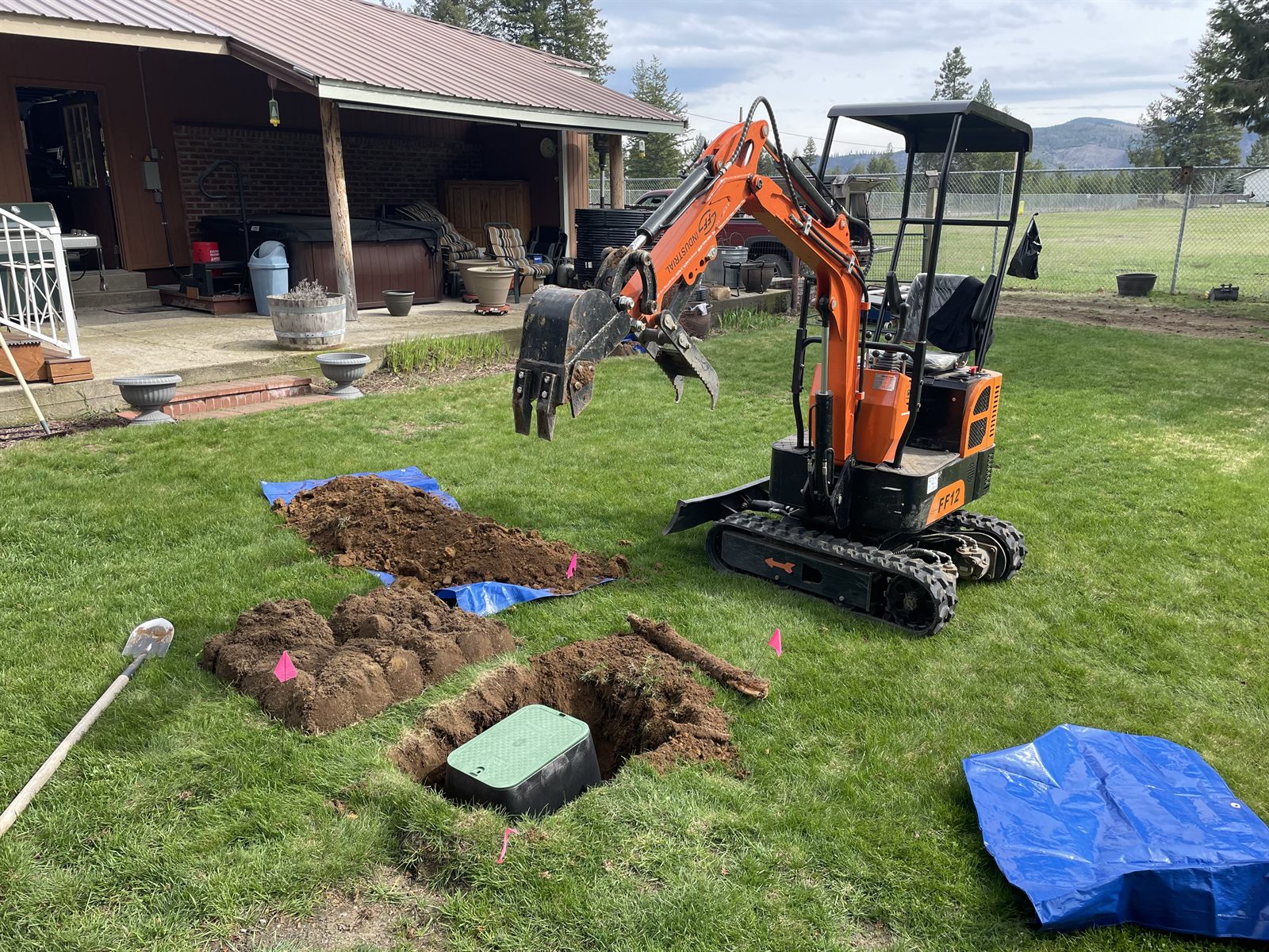 Excavator onsite for irrigation work